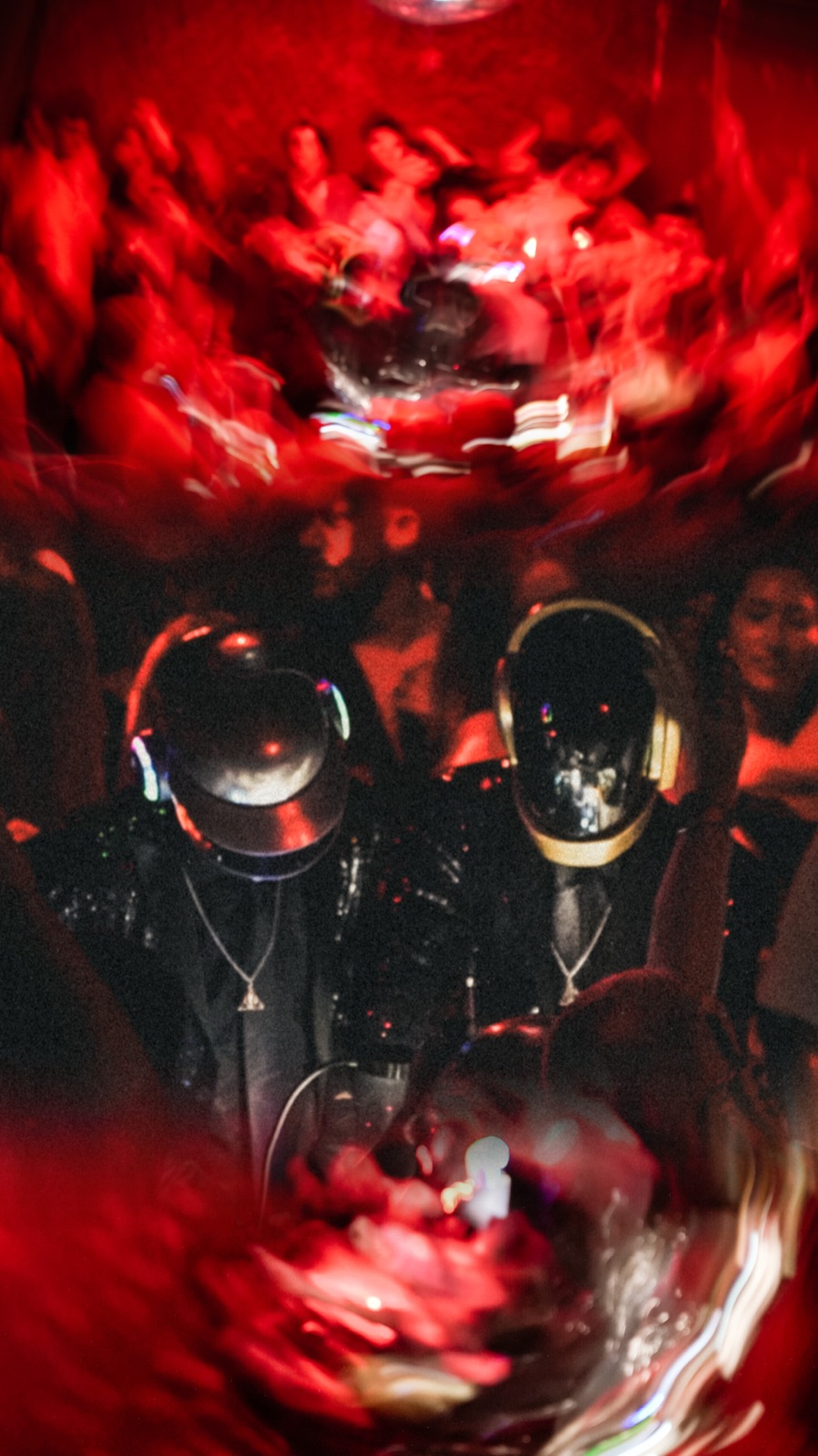 The two robots of ALIVE in red light during a live set