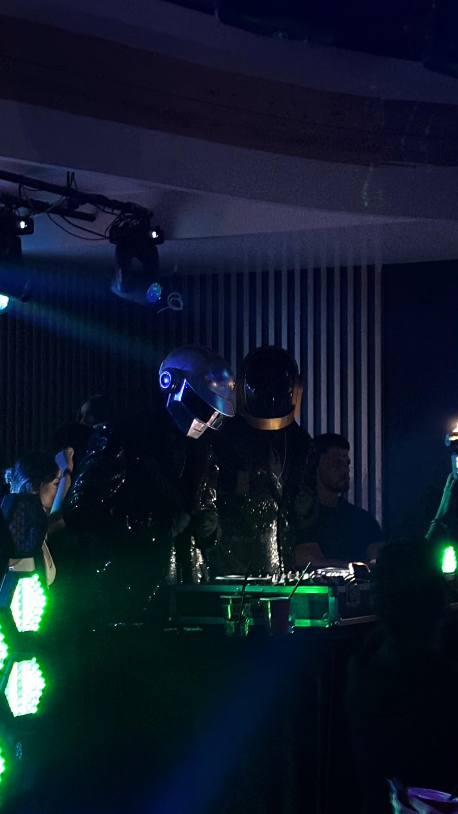 ALIVE at the DJ booth in blue and green stage light